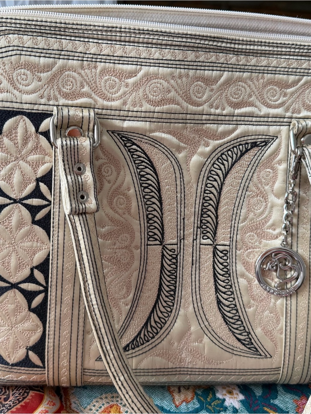 Banda Bags Cream Quilted Tote with Black Embroidered Accents and Charm